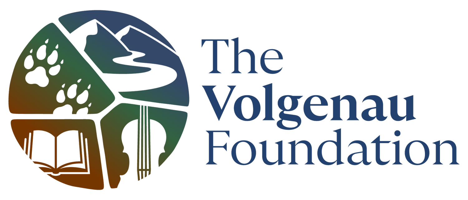 The Volgenau Foundation logo with nature, paw print, book, and music symbols in a circular design.