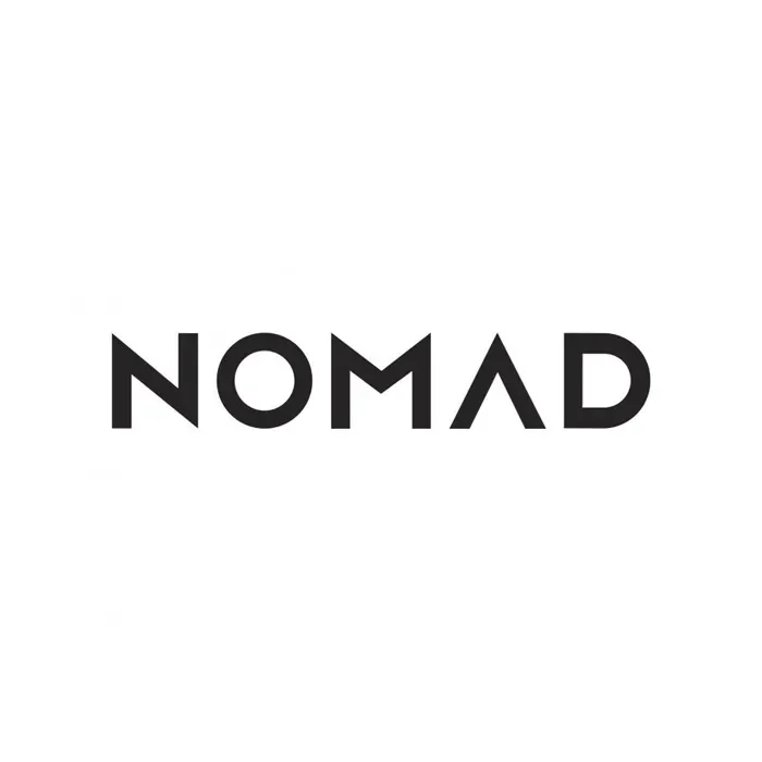 Black text logo that reads "NOMAD" in a modern, minimalist sans-serif font on a white background.